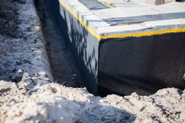 Professional Exterior Waterproofing technician working in Newark, NY